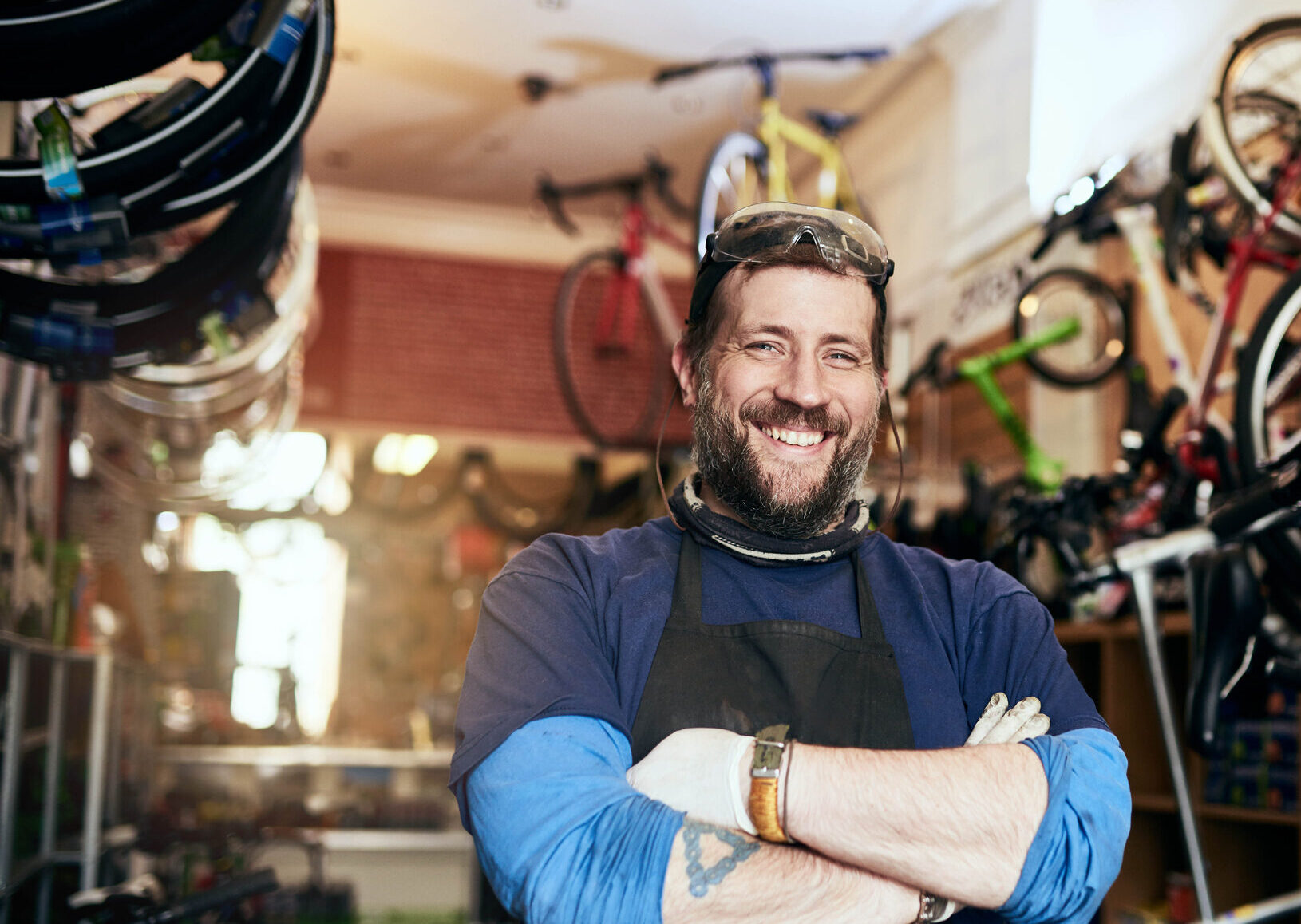 Shot of a handsome man working in his self-owned bicycle workshop Bring All Your Bike Repairs And Maintenance Jobs To Me